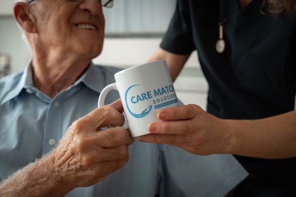 lady handing a mug to someone