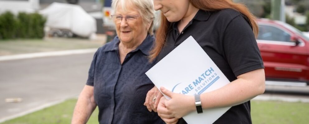 care match solutions worker assisting an older lady in walking