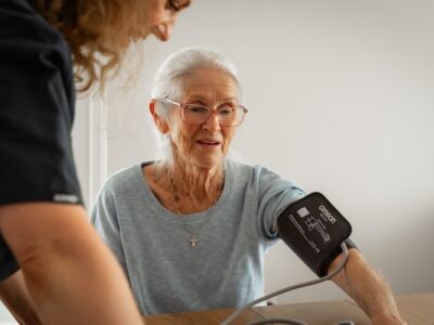 older lady checking blood pressure