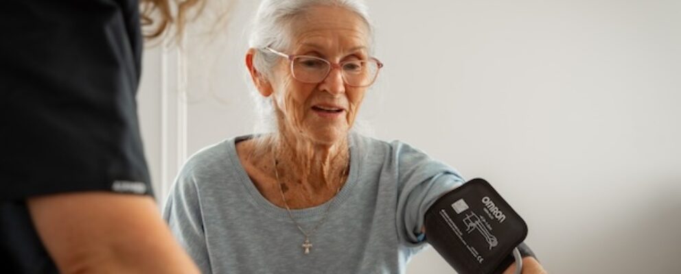 older lady checking blood pressure