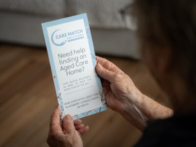 Person holding Care Match SOlutions pamphlet explain the time to think program in WA